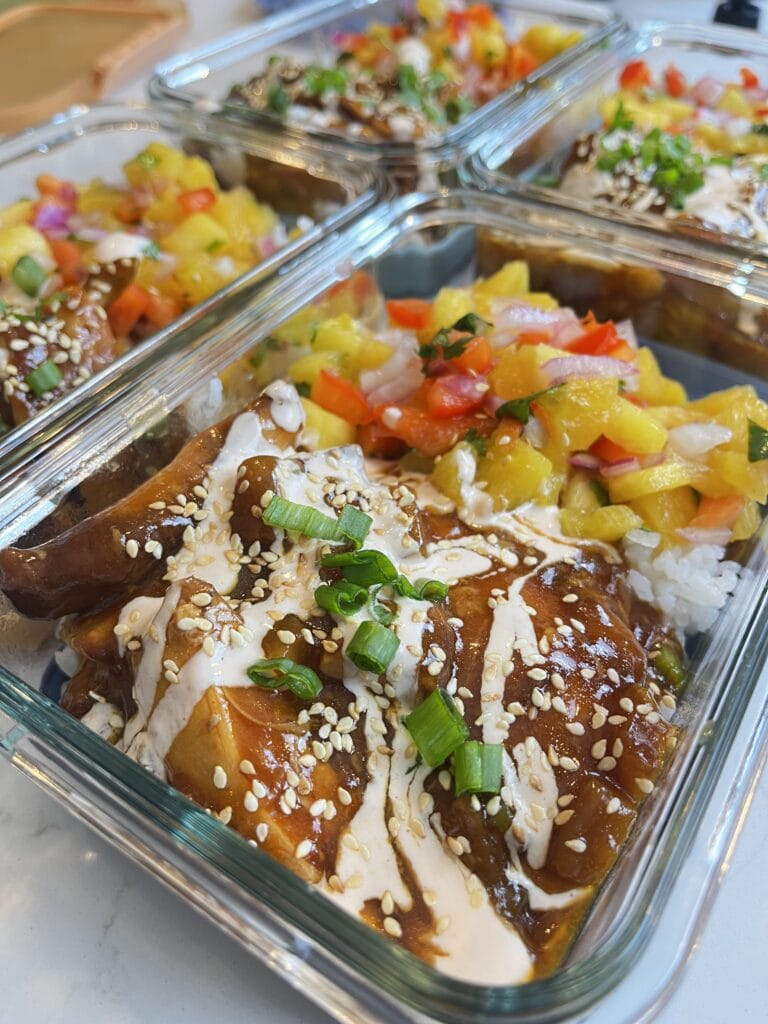 Slow Cooker Honey Garlic Chicken with Chili Lime Drizzle in meal prep containers.